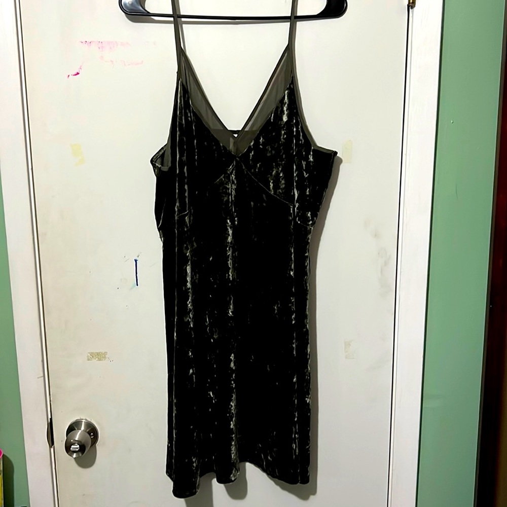 Dark green velvet mini dress. Sheer v at the neckline